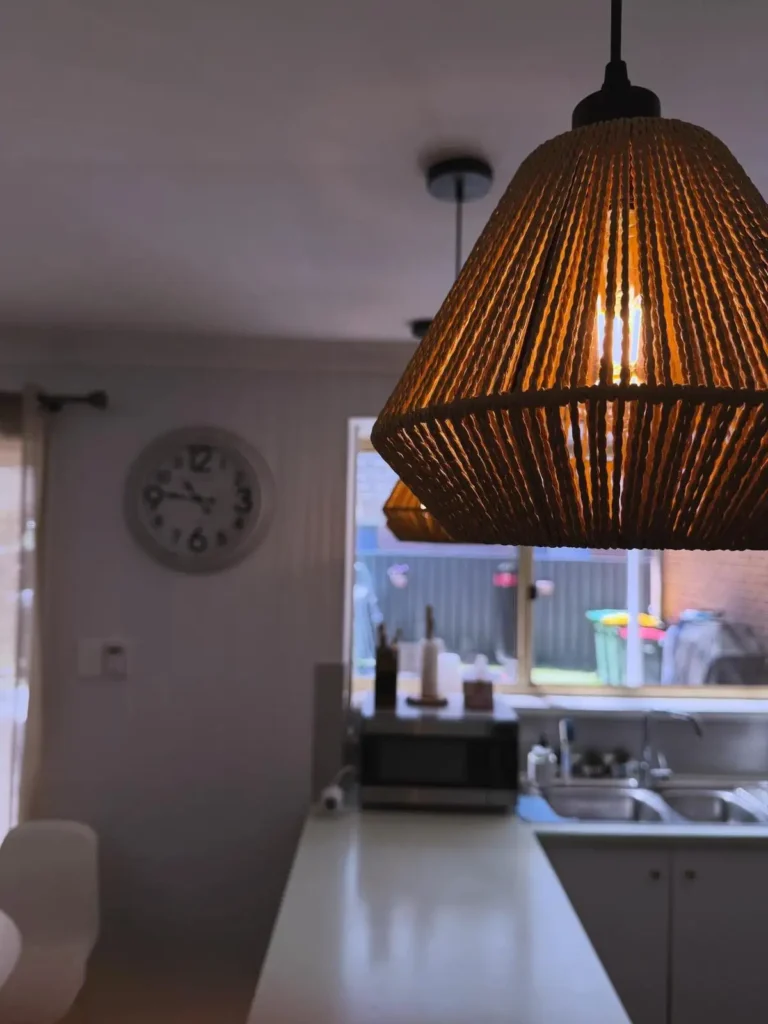 Modern woven pendant light installed in residential kitchen and dining area